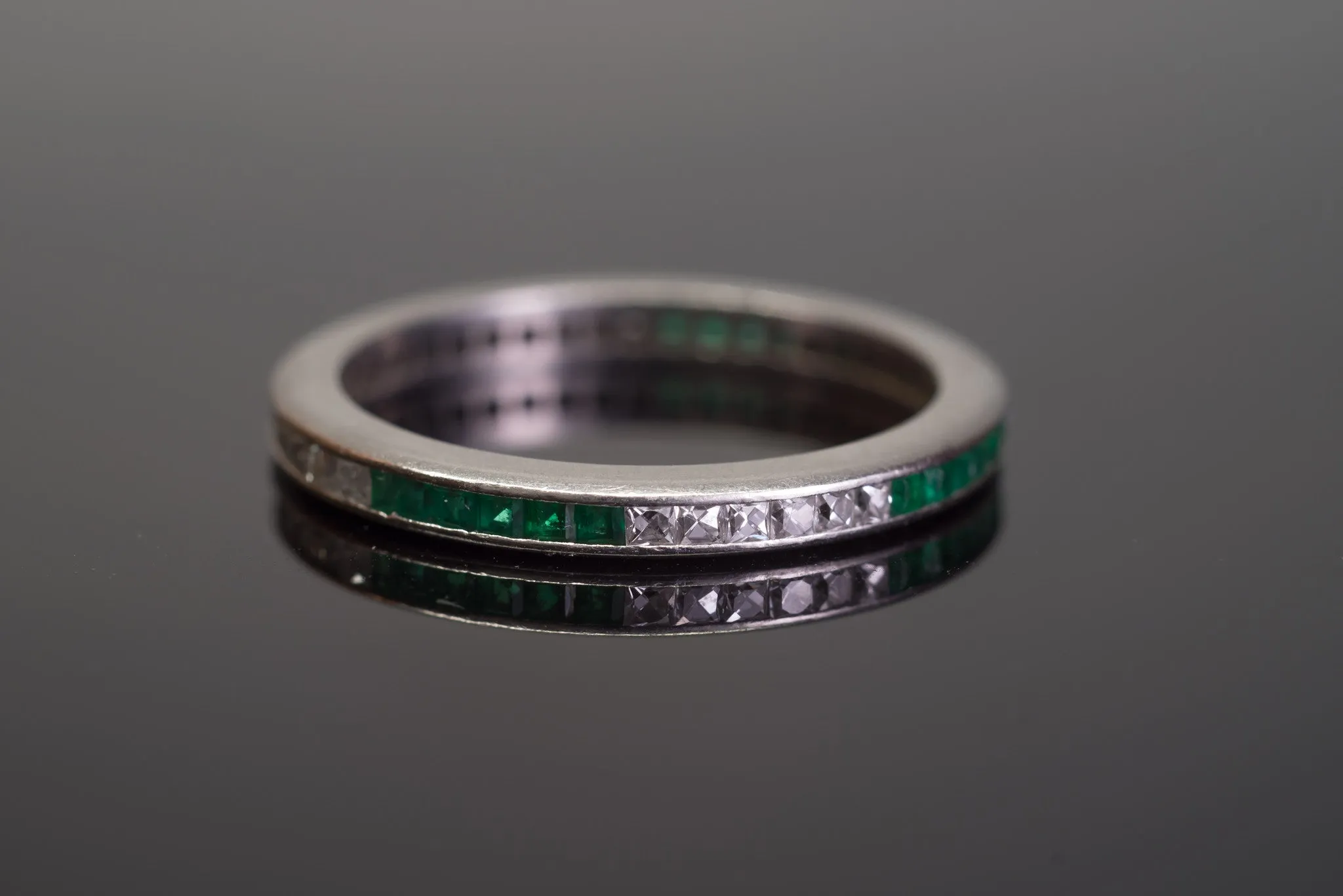 ART DECO FRENCH CUT DIAMOND AND NATURAL EMERALD ETERNITY BAND