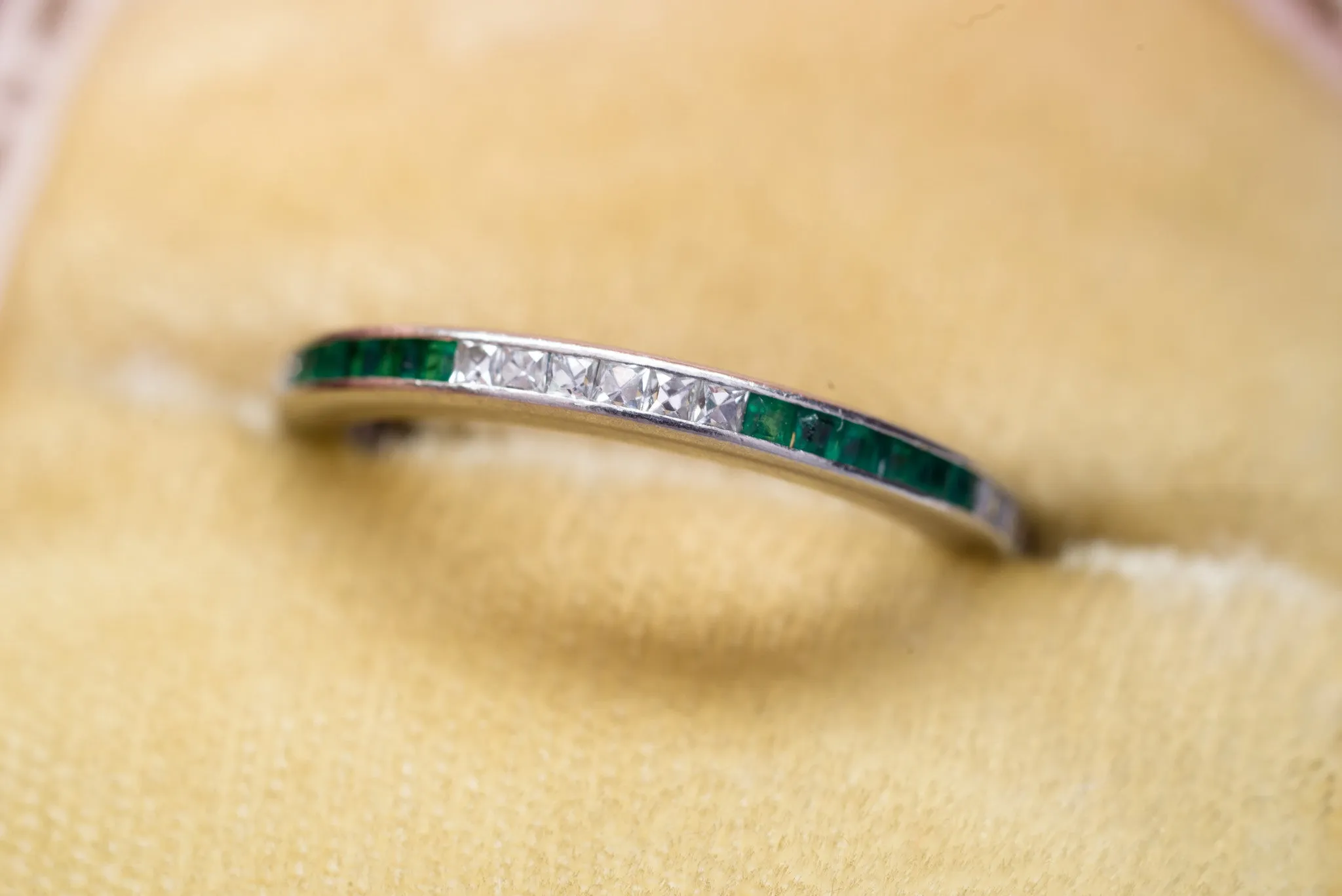 ART DECO FRENCH CUT DIAMOND AND NATURAL EMERALD ETERNITY BAND