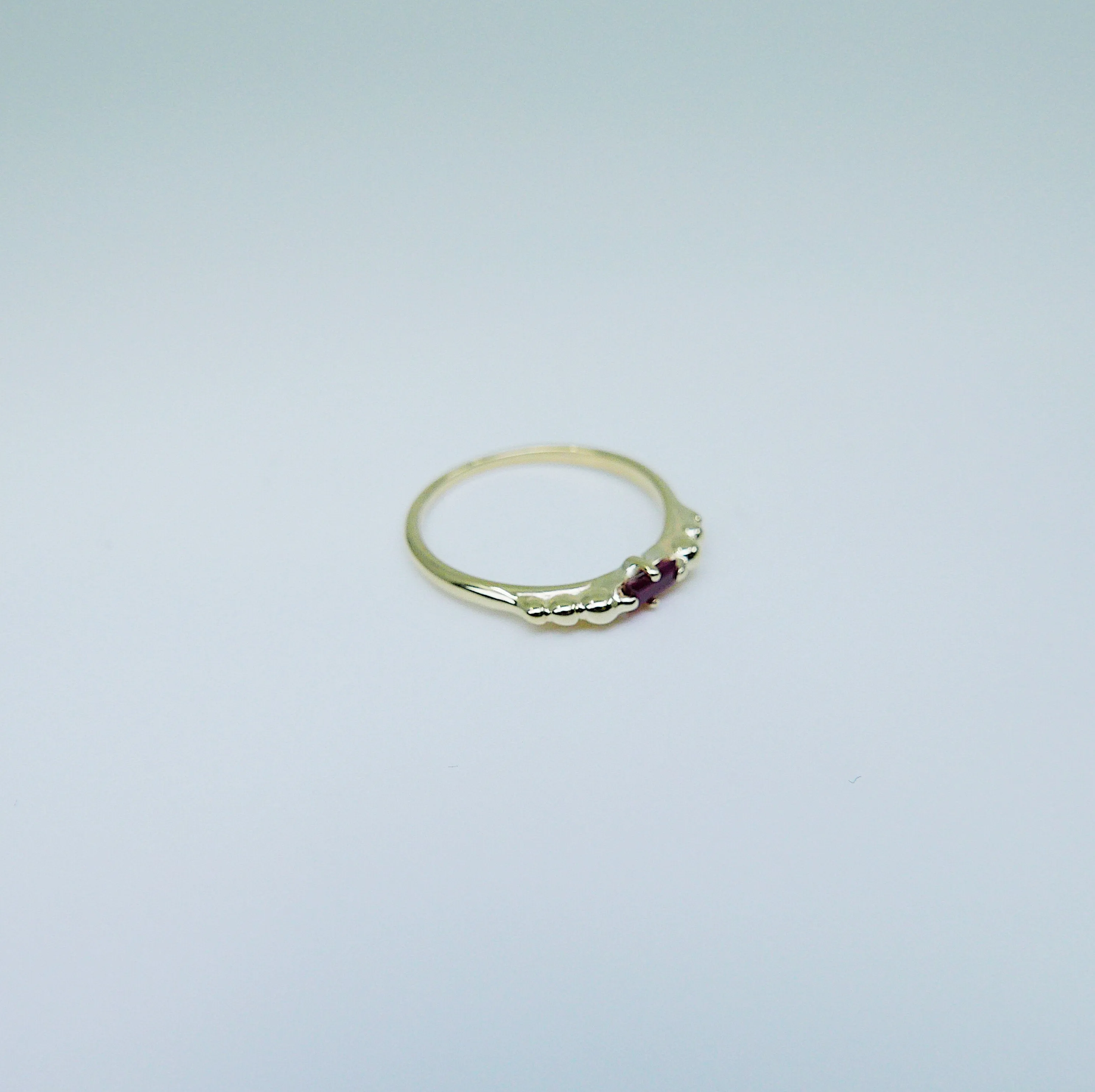 Ellipsis Baguette Ruby Ring