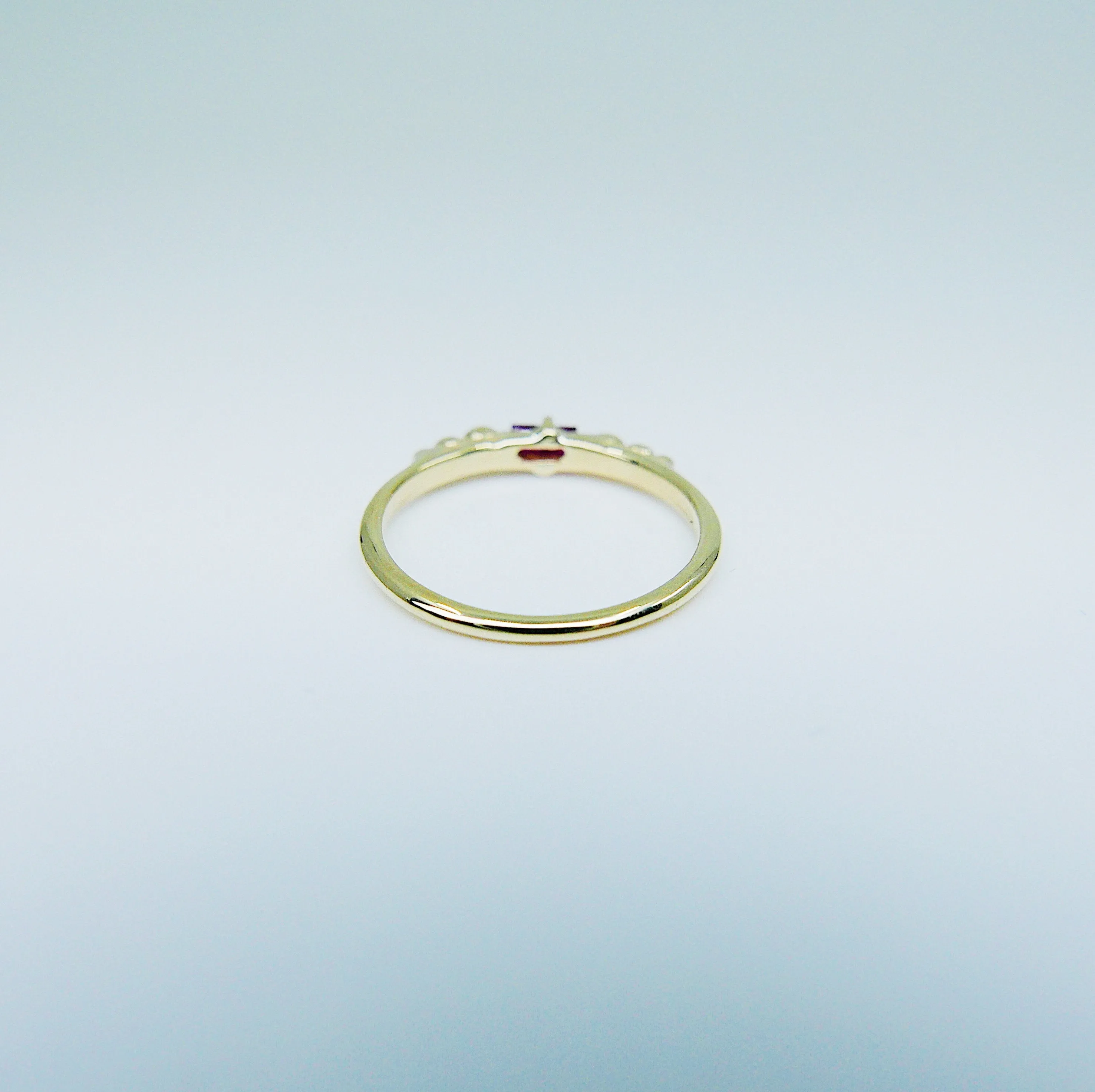 Ellipsis Baguette Ruby Ring
