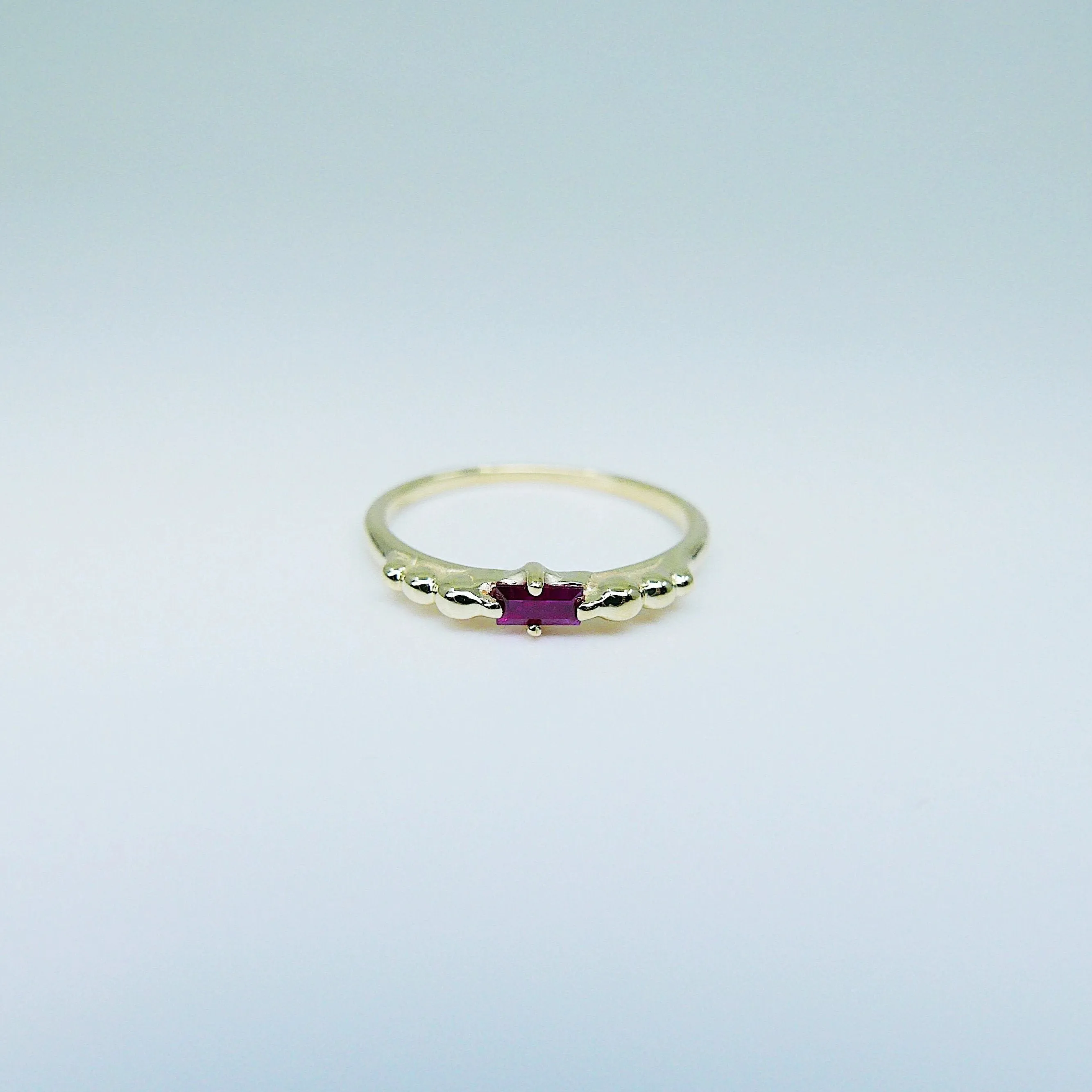 Ellipsis Baguette Ruby Ring