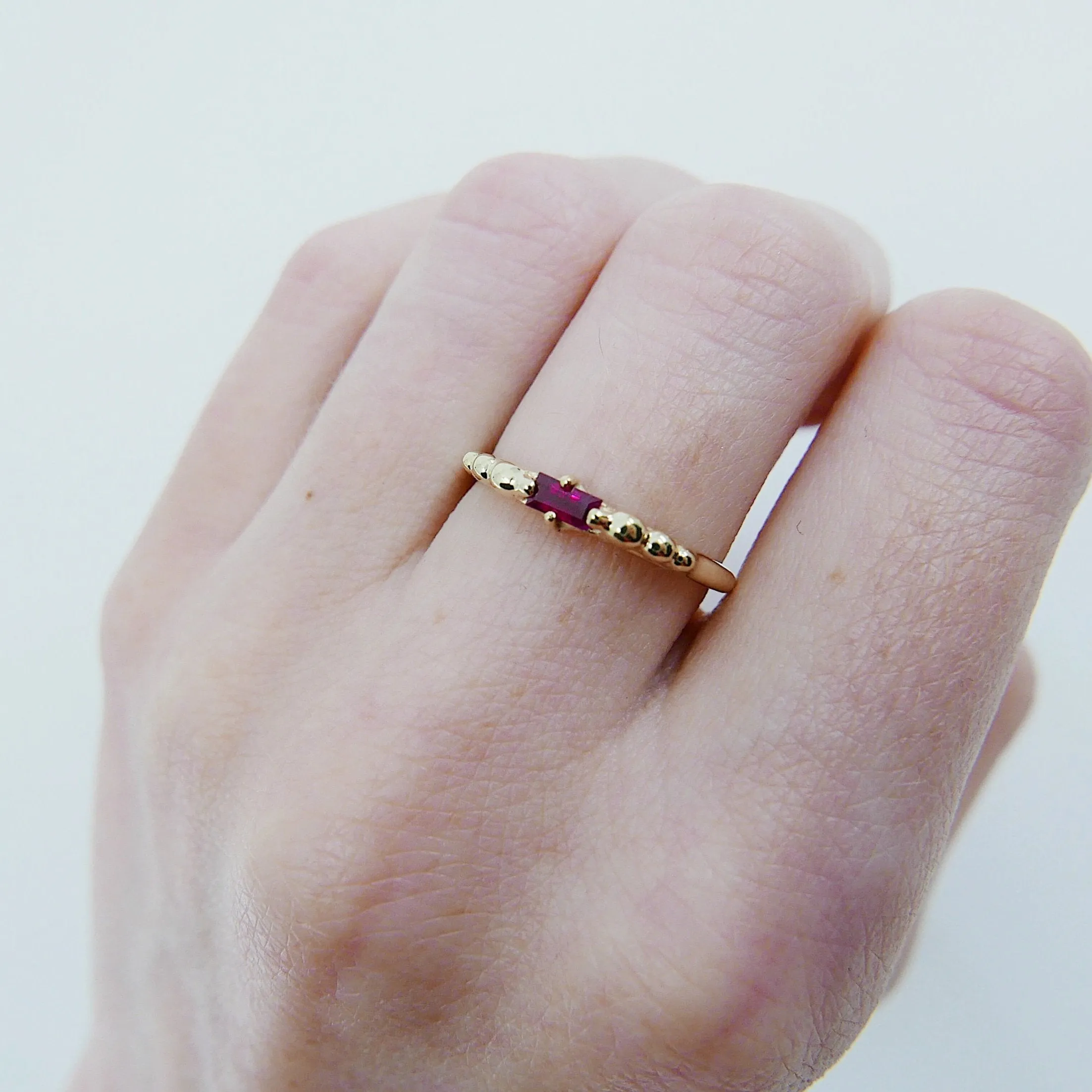 Ellipsis Baguette Ruby Ring