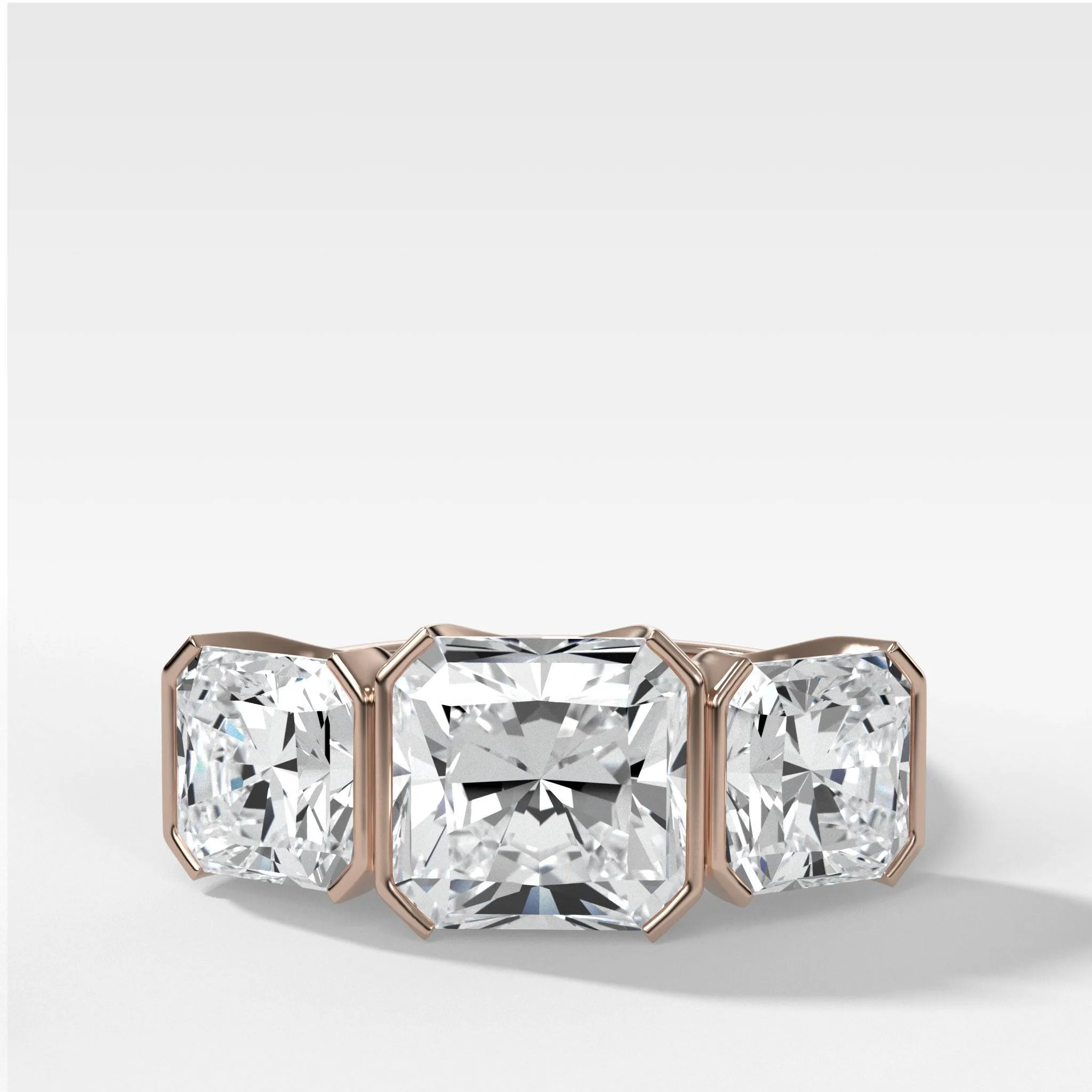 Half Bezel Triad Engagement Ring With Radiant Square Cut Diamonds