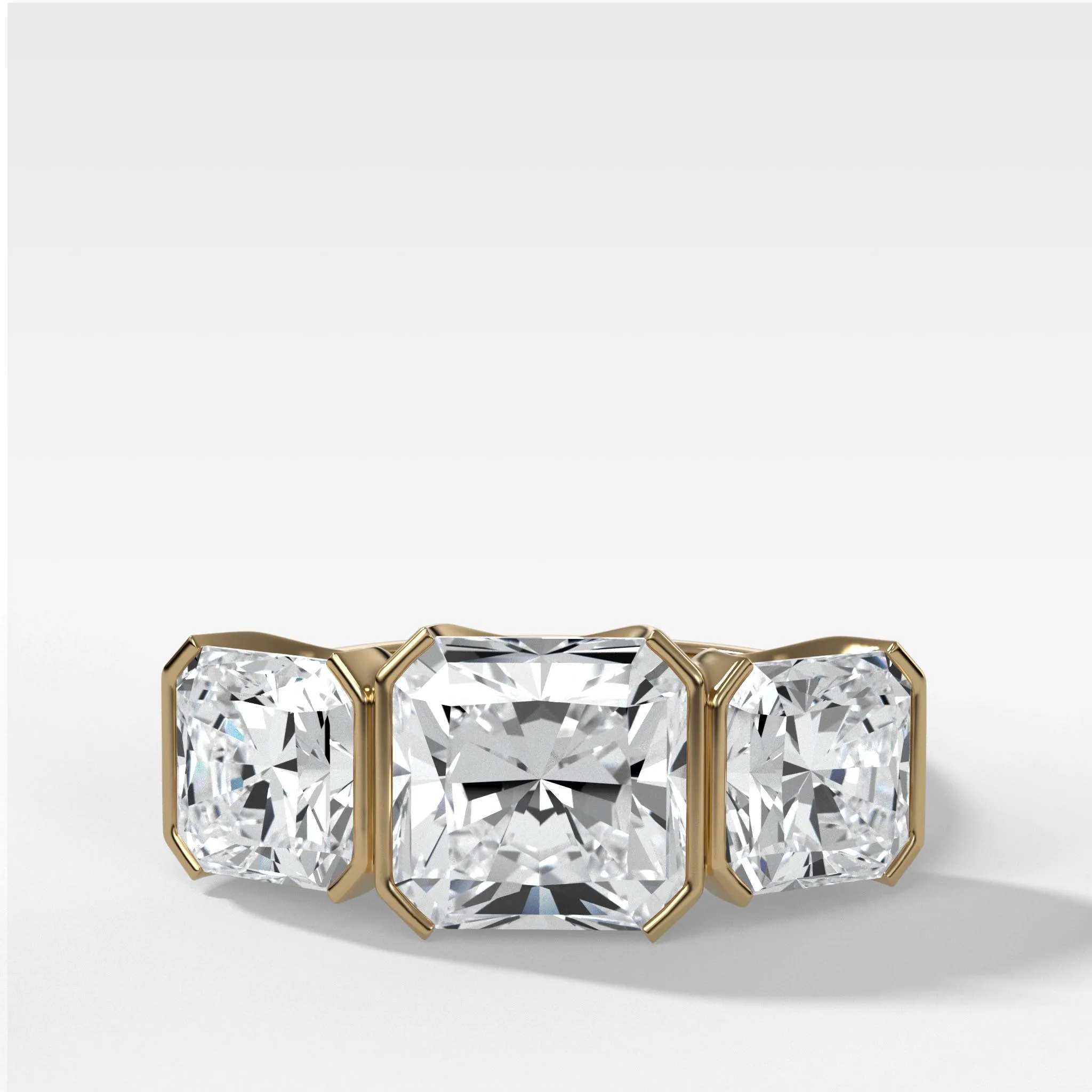 Half Bezel Triad Engagement Ring With Radiant Square Cut Diamonds