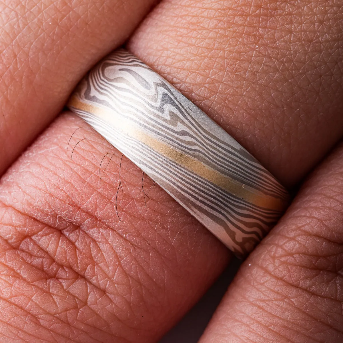 Hand Crafted Mokume Gane Wedding Band or Ring in Twist Pattern and Smoke Palette with Yellow Gold Stratum