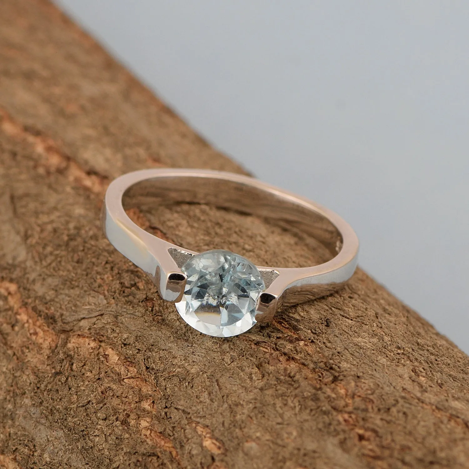 Solitaire 7mm Round Blue Topaz Gemstone Open Prong Ring